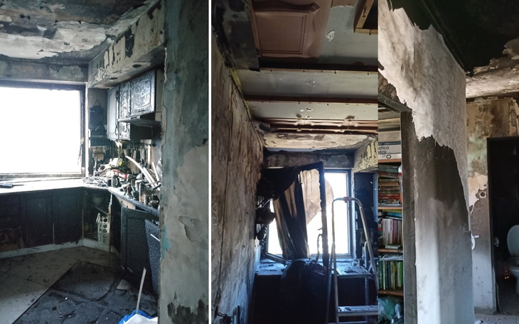 Zniszczona kuchnia po pożarze, z uszkodzonymi ścianami i meblami.