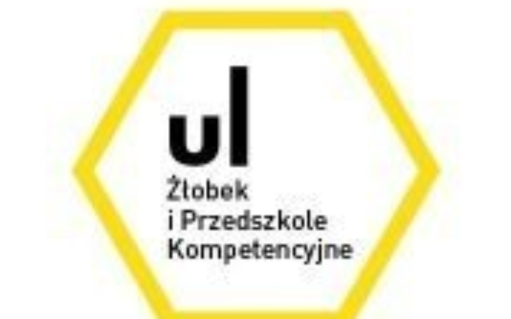 Logo żłobka i przedszkola, żółta hexagon z napisem.