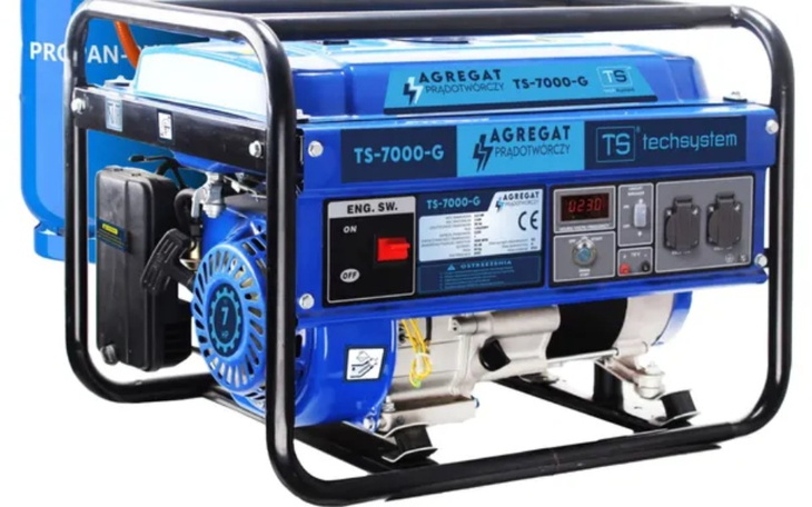 Generator prądu, niebieski z różnymi przyciskami i wskaźnikami.