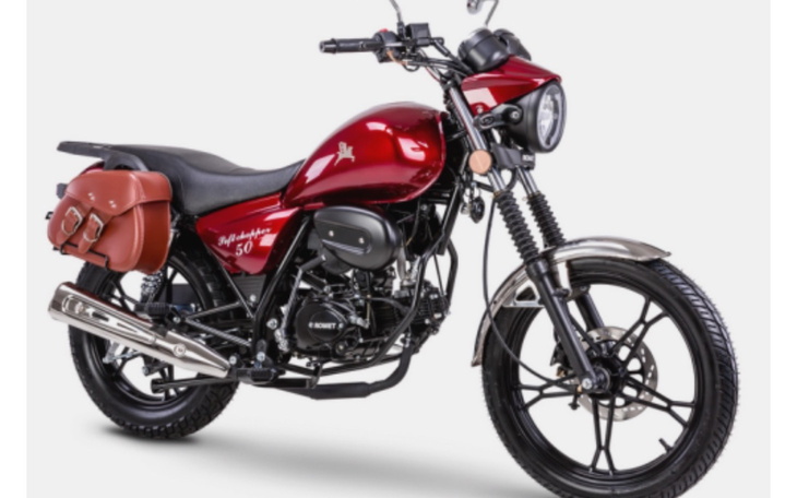 Czerwony motocykl z torbą na boku.