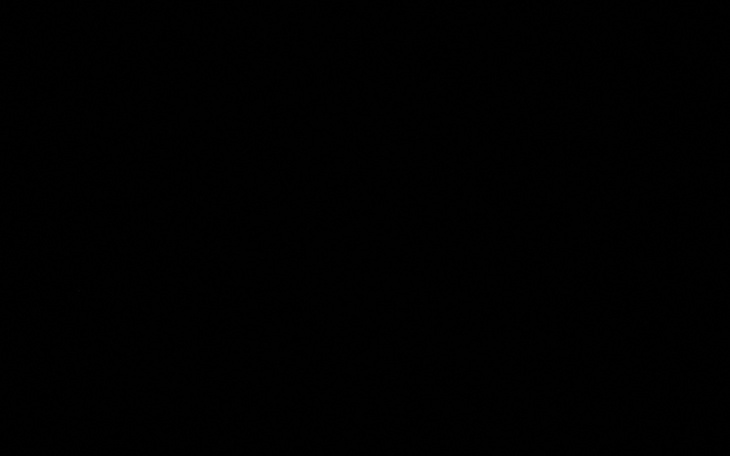 Ciemny obraz, prawdopodobnie zdjęcie w nocy.