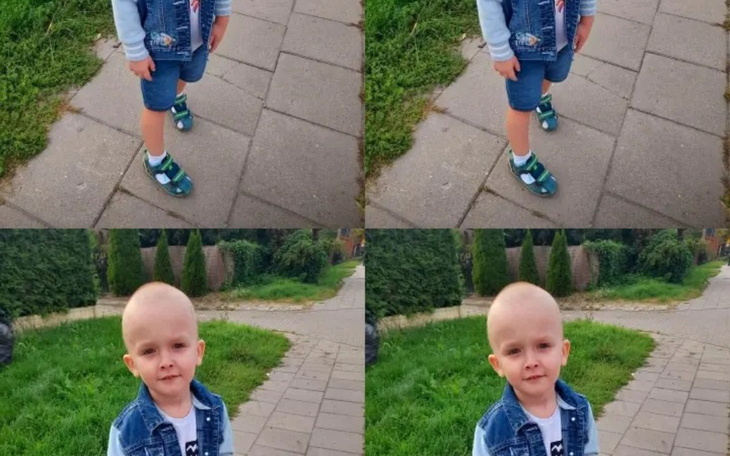 Chłopiec w dżinsowej kurtce, stojący na chodniku.