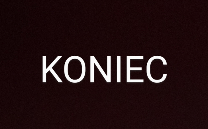 Czarny ekran z napisem 'KONIEC', kończący prezentację.