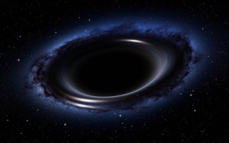 Czarna dziura w przestrzeni kosmicznej, otoczona gwiazdami.