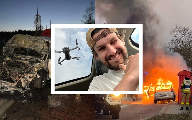 Zniszczony samochód po pożarze, w tle dym i zniszczenia.