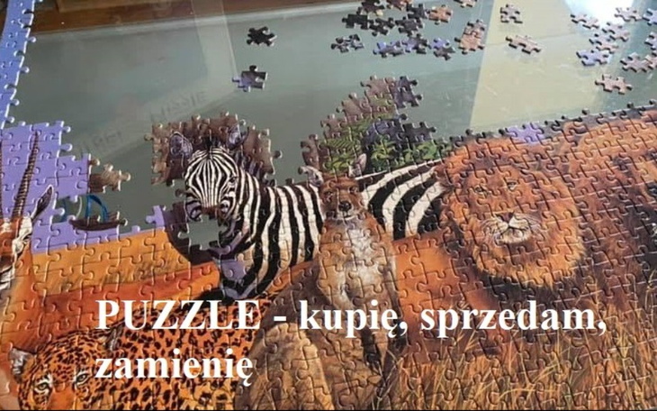 Puzzle na stole z fragmentami zwierząt.