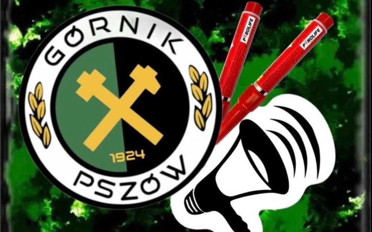 Logo klubu sportowego Górnik Pszów z narzędziami i dzwonkiem.