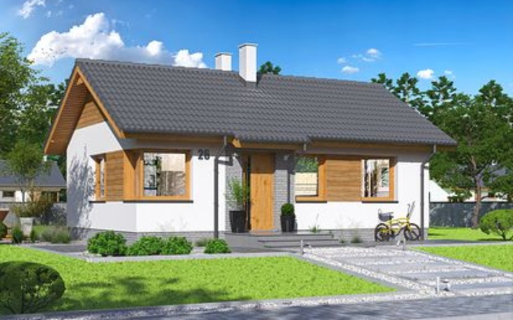 Nowoczesny dom jednorodzinny z ogrodem i ścieżką dojazdową.