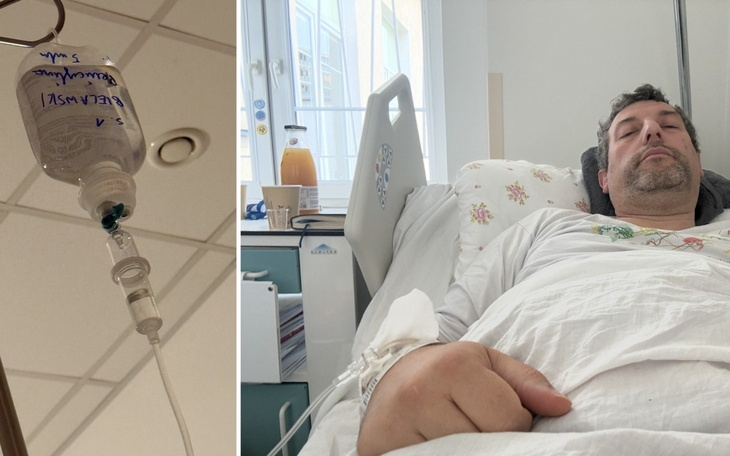 Osoba leży w szpitalnym łóżku, wpatrując się w kamerę.