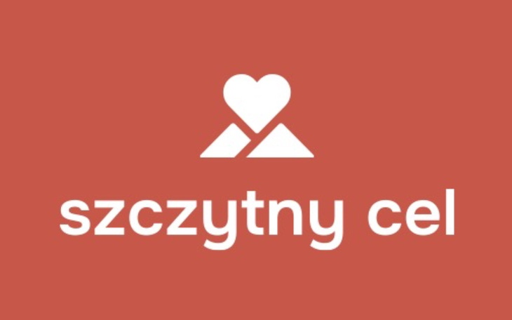 Logo organizacji charytatywnej z sercem i górami.