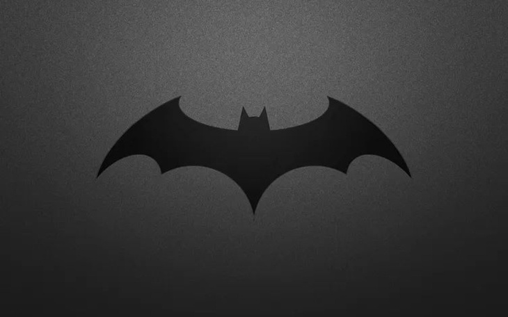 Symbol Batmana na ciemnym tle.