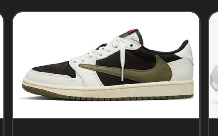 Sneakersy w czarno-białym kolorze z zielonym akcentem.