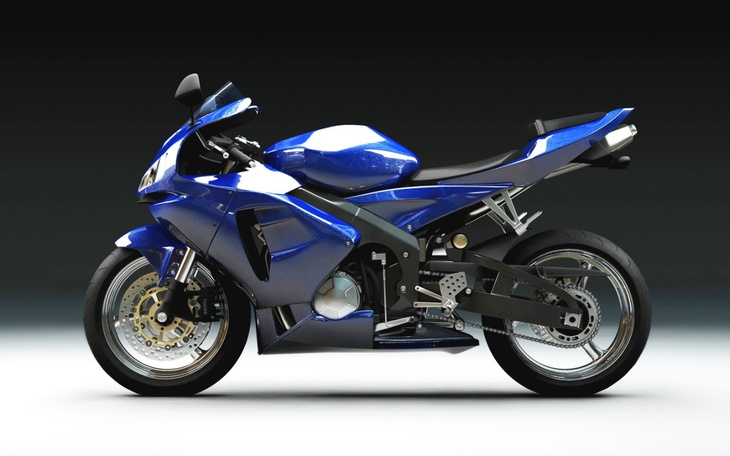 Motocykl sportowy w niebieskim kolorze, nowoczesny design.