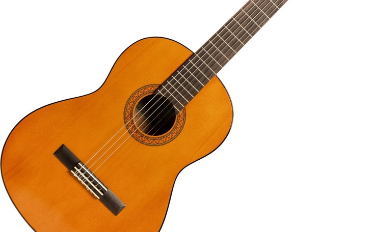 Gitary akustyczne na białym tle.