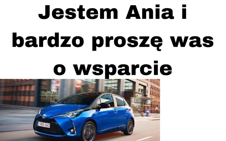 Samochód Toyota na tle miejskiego krajobrazu.