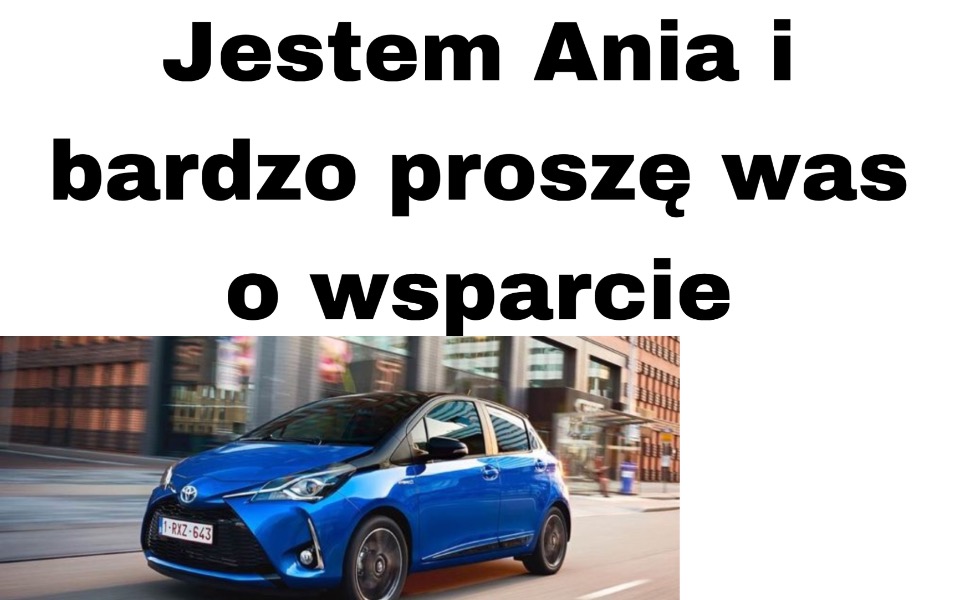 
        Samochód Toyota na tle miejskiego krajobrazu.
    