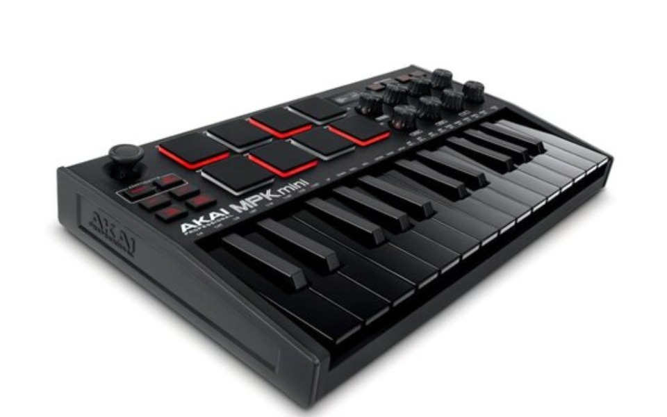 
        Mikser MIDI z klawiszami i padami do produkcji muzycznej.
    