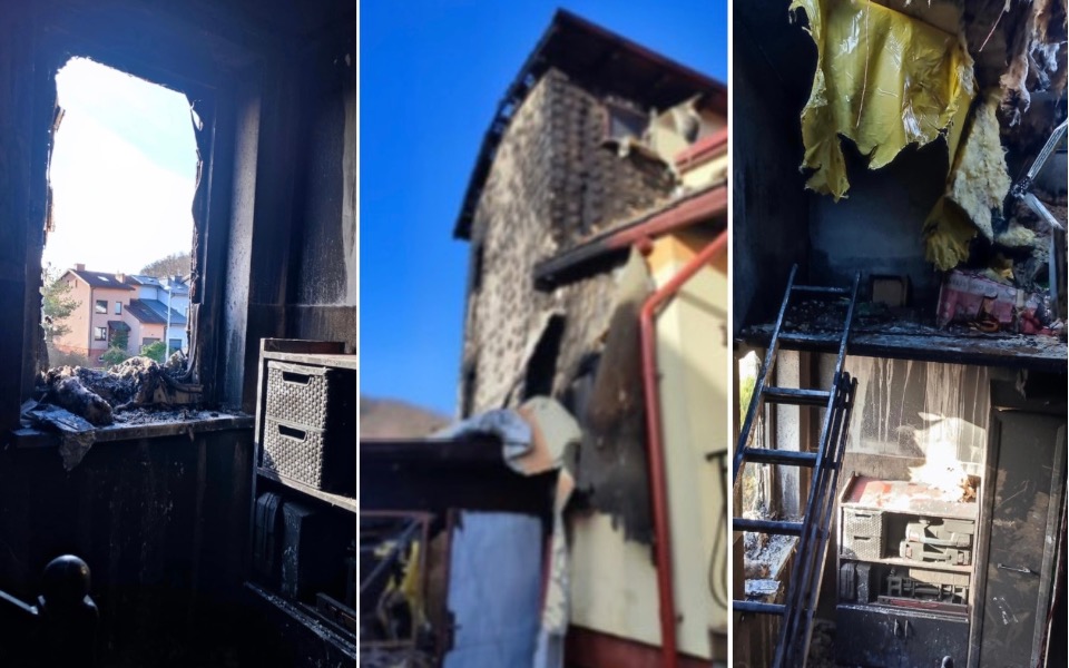 
        Zniszczone wnętrze po pożarze, z widokiem na zewnątrz.
    