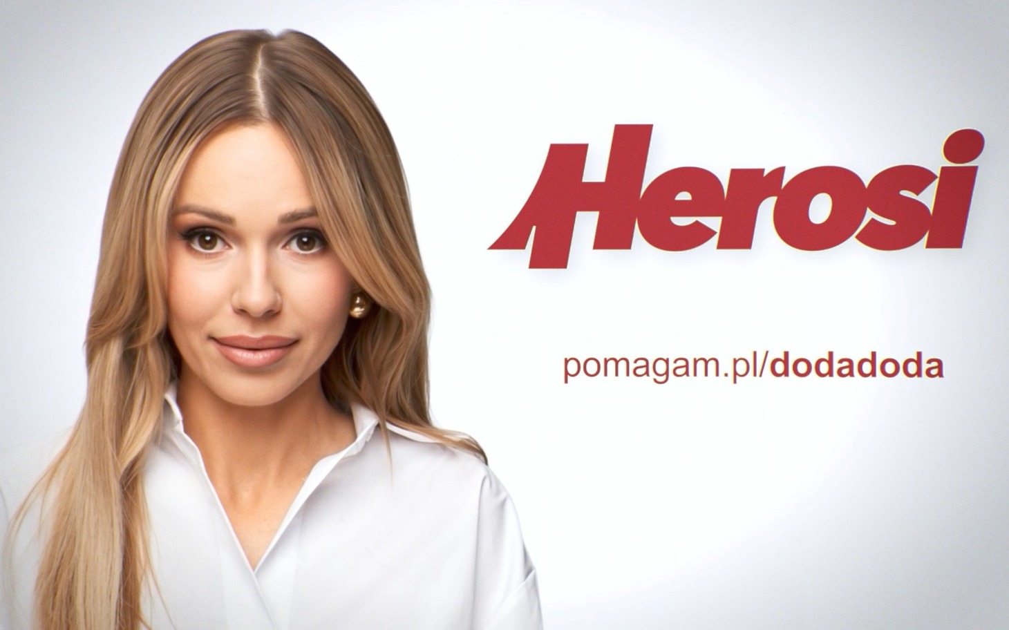
        Kobieta z długimi włosami, promująca projekt Herosi.
    