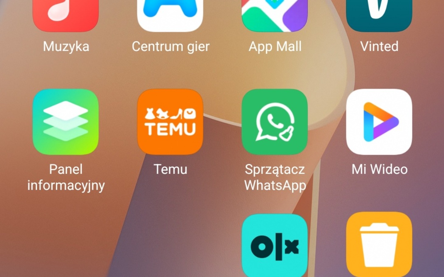 
        Ekran smartfona z aplikacjami, w tym WhatsApp i OLX.
    