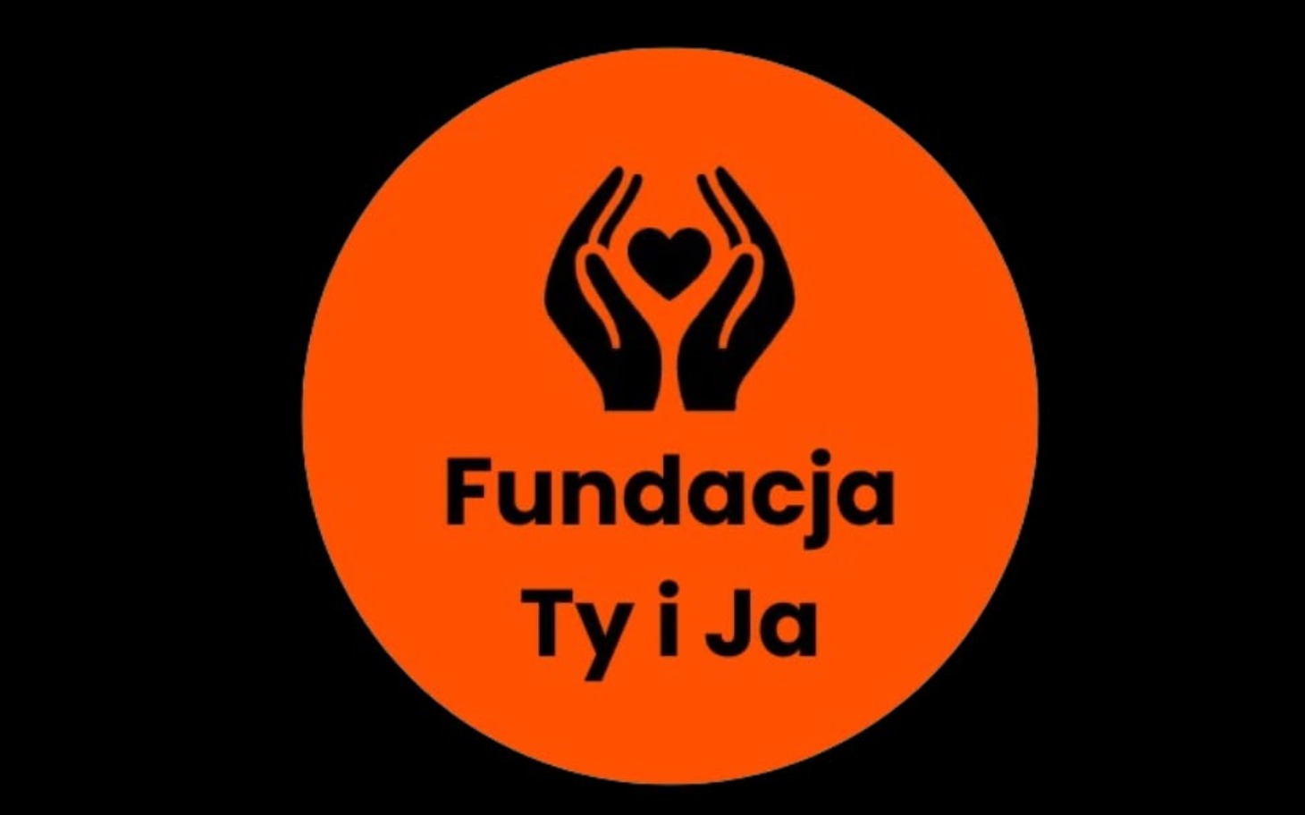 
        Logo Fundacji Ty i Ja, symbolizujące pomoc i wsparcie.
    